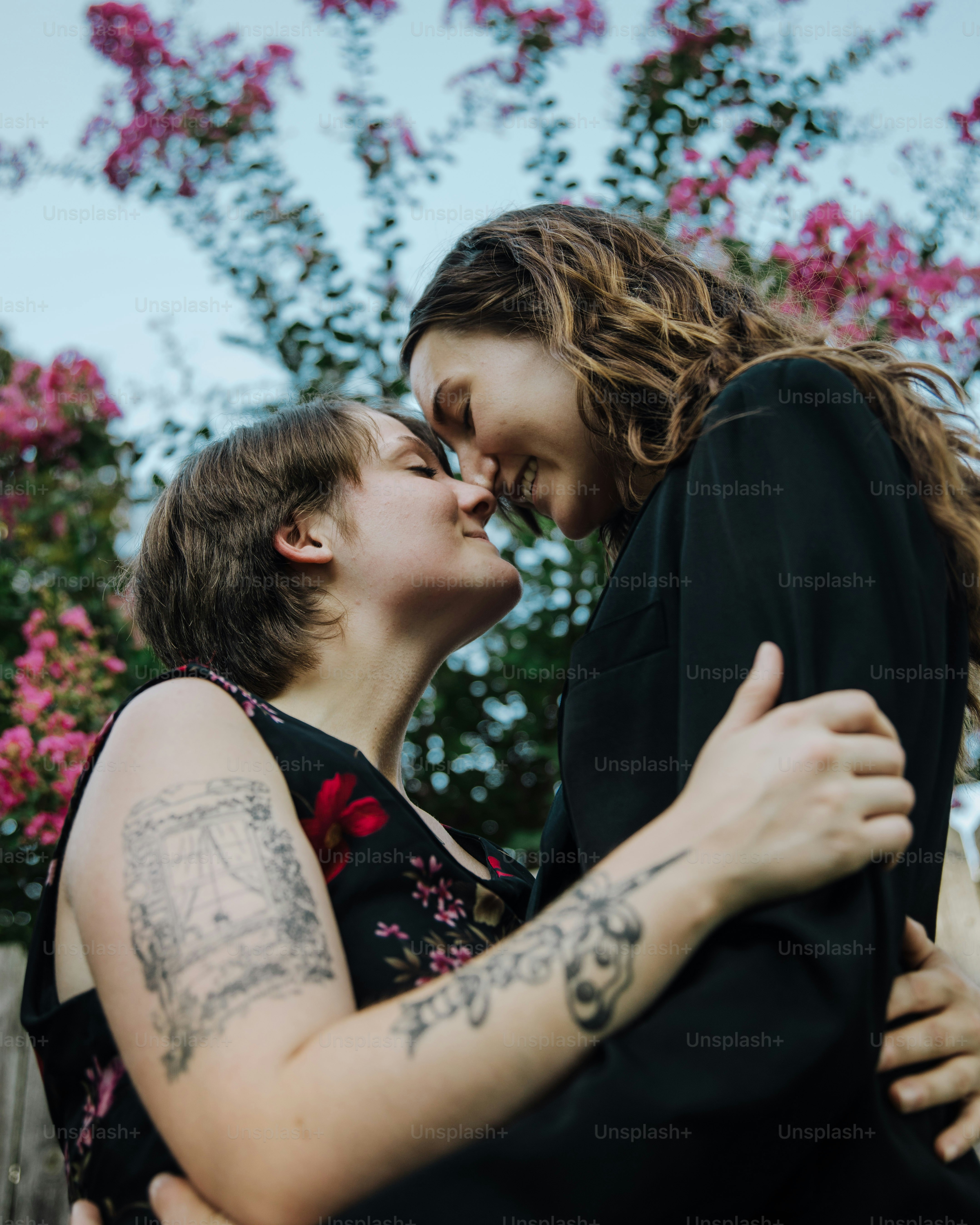 a couple of people that are hugging each other